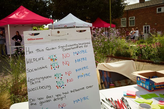 Photo of a community feedback board displaying the benefits of the Nature Hub in the local area