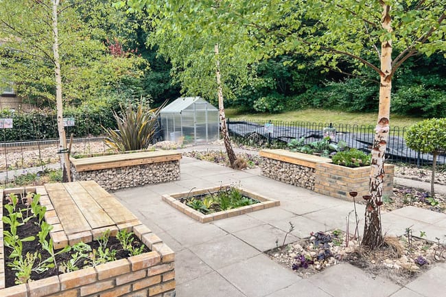 A photo capturing the transformation of the project, and the designed garden with seating areas