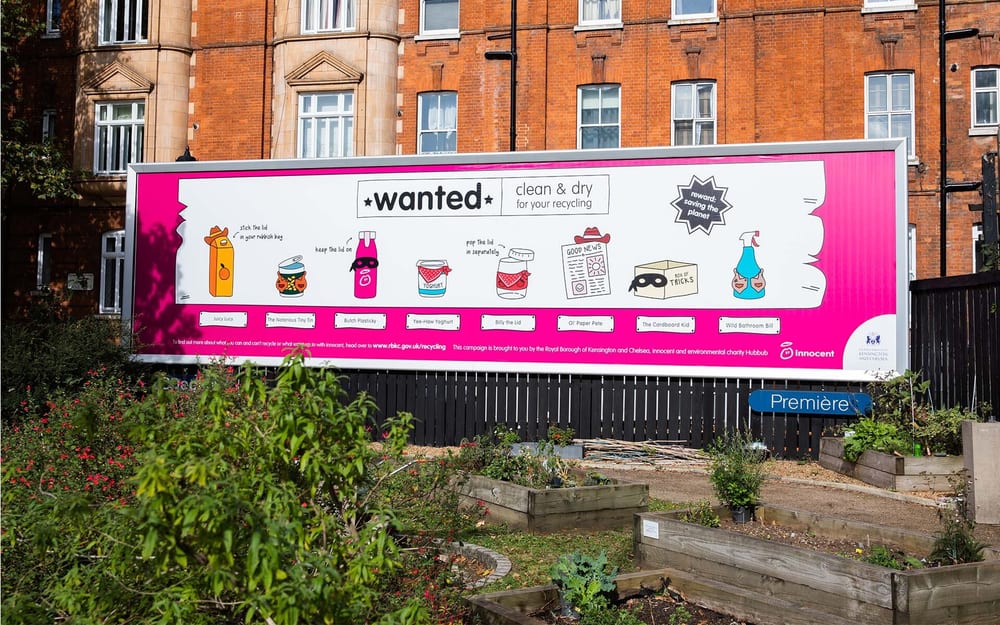 A billboard on a street with the most 'wanted' recycling items.